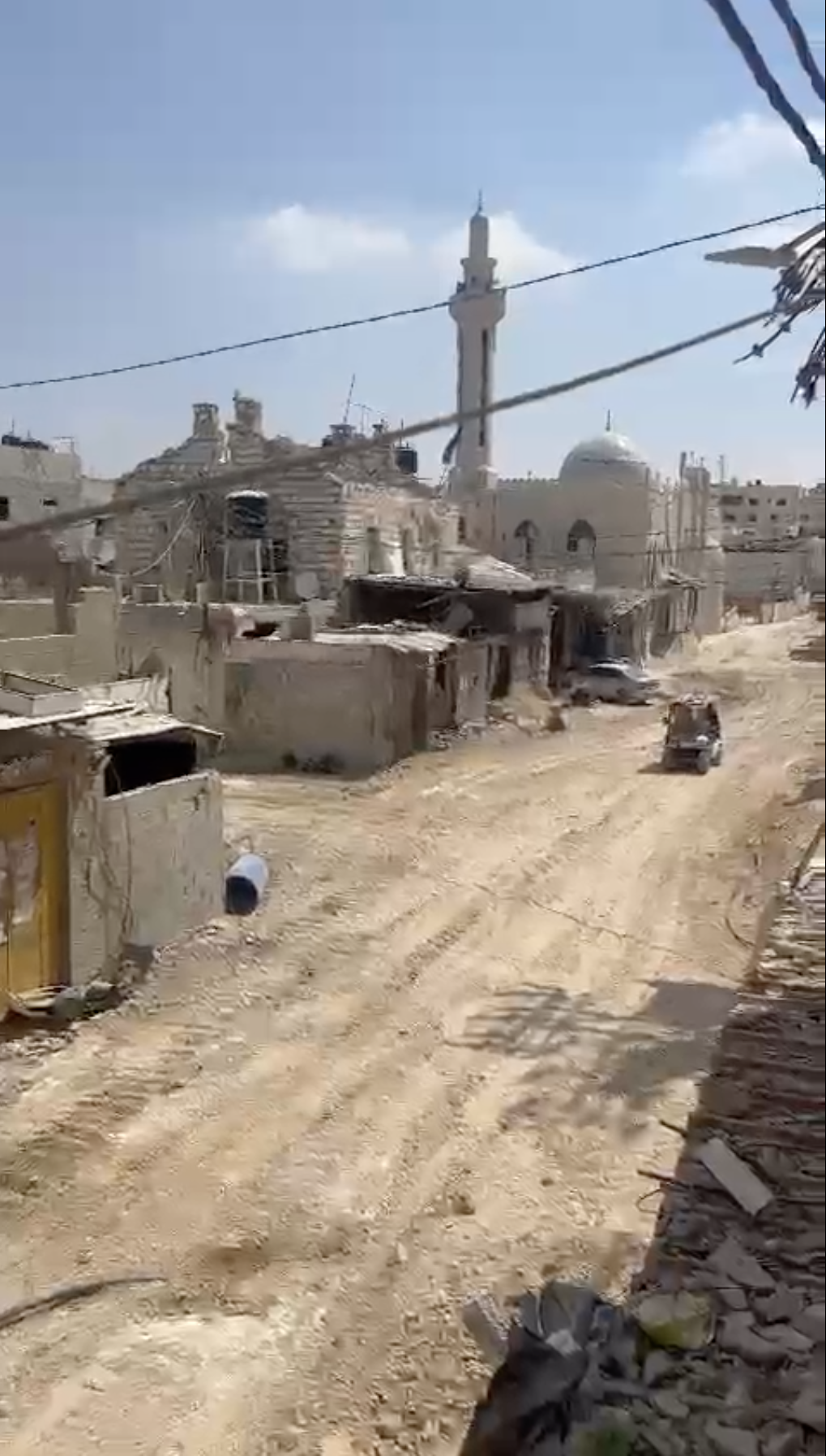 A screengrab shows volunteer paramedics driving past the Bawaqneh family home [Courtesy of Saja Bawaqneh]